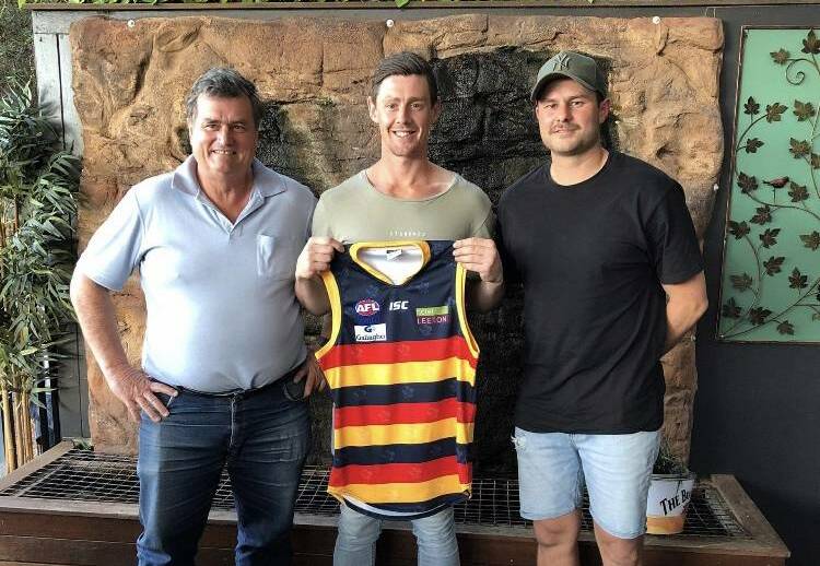 INVESTED: Leeton-Whitton president Tim Carroll (left) and current coach Daniel Muir (right) with Sam Darley late last year. 