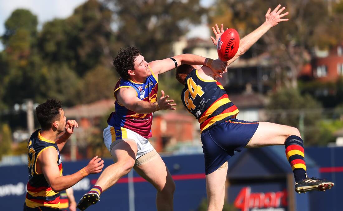 HARD AT IT: GGGM's Riley Corbett and Leeton-Whitton's Mason Dryburgh contest a mark during Saturday's preliminary final. Picture: Emma Hillier
