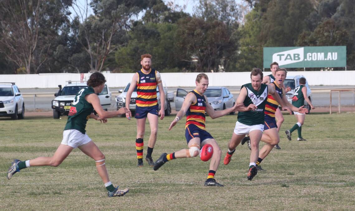 ON THE ATTACK: Leeton-Whitton's Danyan Evans sends the ball forward against Coolamon at Leeton Showground on Saturday. Picture: Anthony Stipo