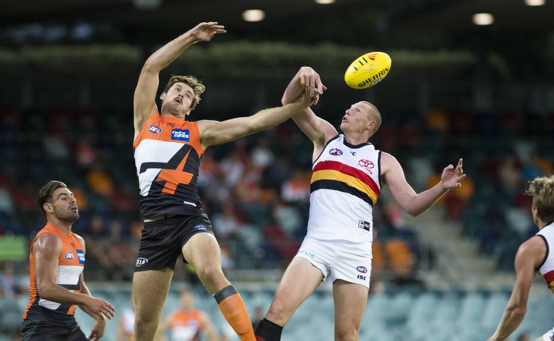 SHOWING PROMISE: Matt Flynn in action for the Giants competing against Adelaide's Sam Jacobs in an AFL pre-season game earlier in the year. Picture: Dion Georgopoulos