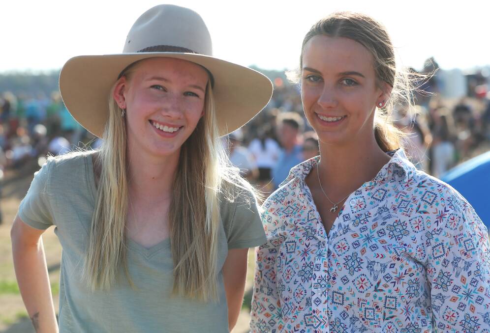 READY TO RACE: Junee teenager Grace Fahy (right), pictured with Wagga's Alesha Bennett, will have her first race drive at Leeton on Tuesday night. Picture: Emma Hillier