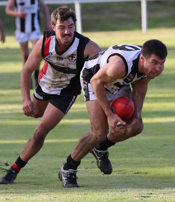 WAITING GAME: The Rock-Yerong Creek former coach Tom Yates looks to get away from new North Wagga coach Cayden Winter at McPherson Oval. Picture: Les Smith