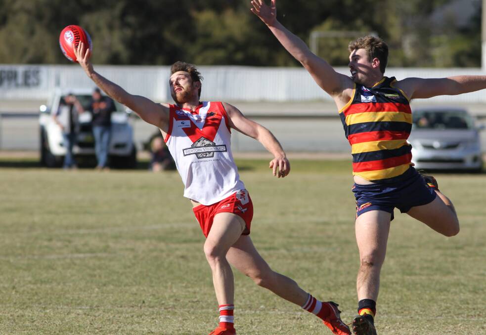 CLOSE CALL: Griffith's Heath Northey tries to reel the ball in during the game against Leeton-Whitton at Leeton Showground on Saturday. Picture: Liam Warren