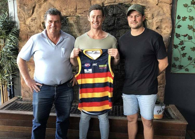 NEW COLOURS: New Leeton-Whitton coach Sam Darley (middle) with president Tim Carroll and outgoing coach Daniel Muir. 