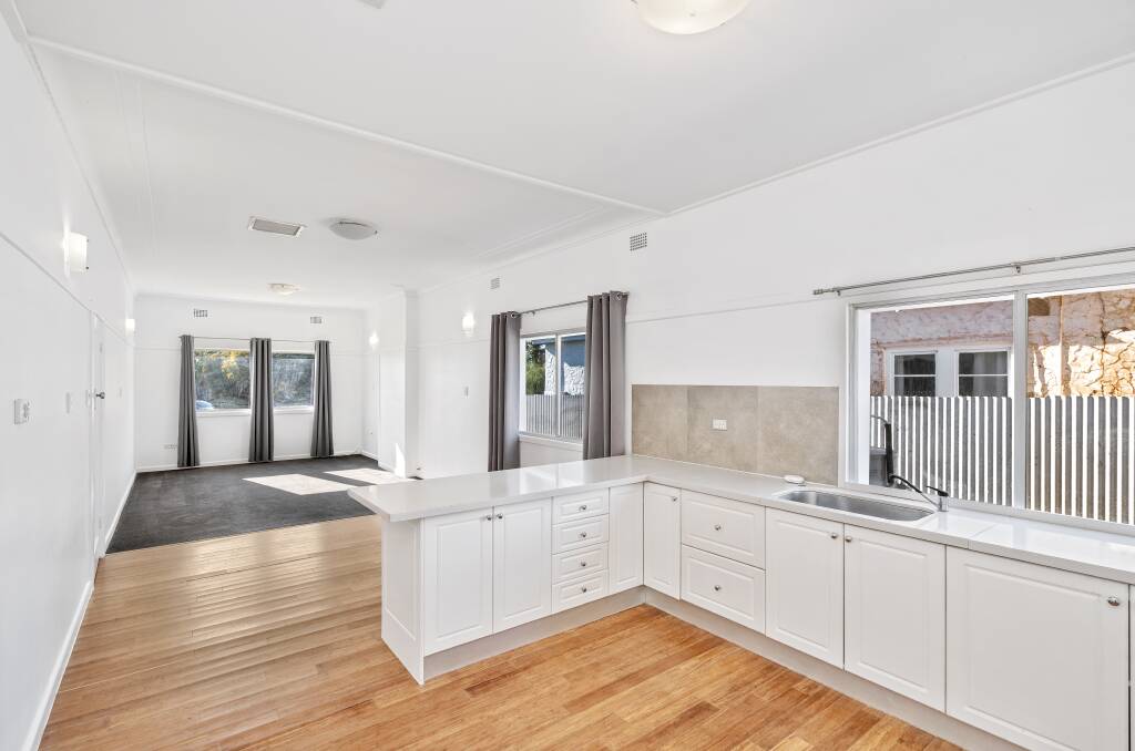 INVESTMENT: With home and unit combined, the property boasts five bedrooms, two living areas, two bathrooms, two kitchens, and ample parking for up to eight cars at the back of the property. Photo: Supplied