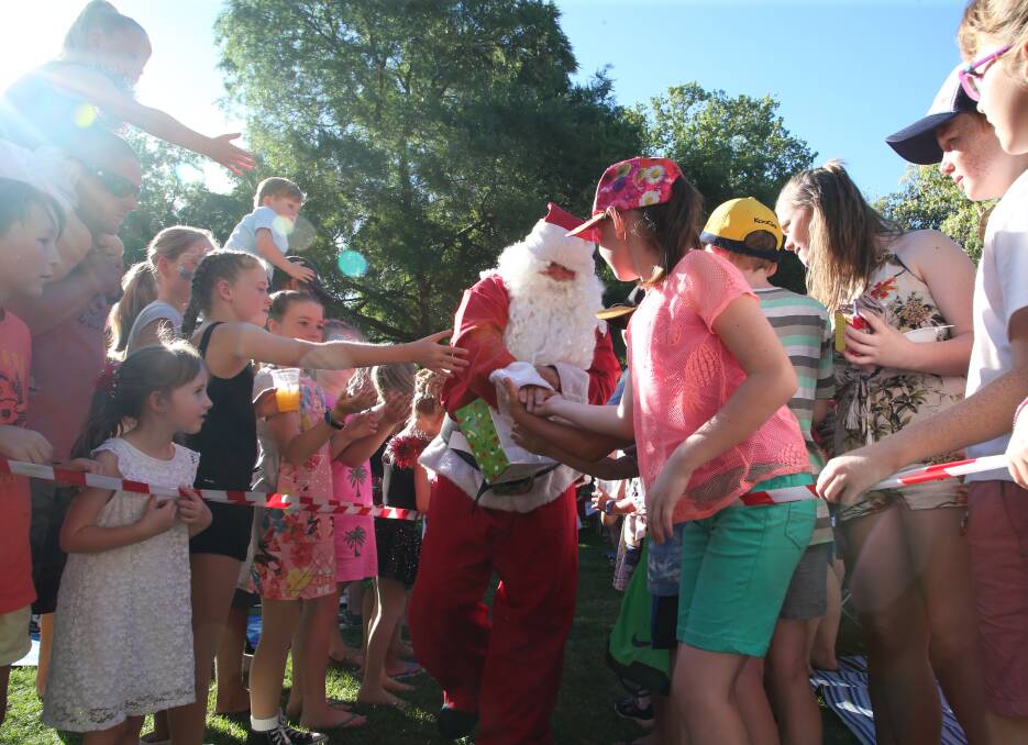 JOLLY RED GENT: Santa and Mrs Claus will be welcomed into Mountford Park at 6pm to kick of the Light Up Leeton Christmas concert on Sunday, December 2.