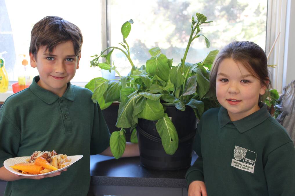 GOOD GROWING: Whitton Murrami PS students Indigo and Ilah with produce from the school's Stephanie Alexander Kitchen Garden.