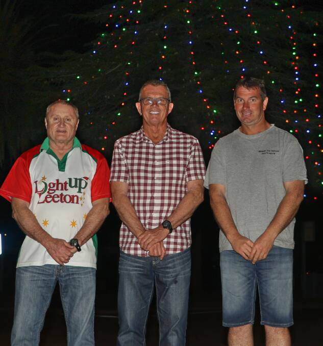 LIGHT Up Leeton, represented by chairman Carl King, electrician David Dowling and Brett Deaton from Proplop Tree Removal combined to install the lights.