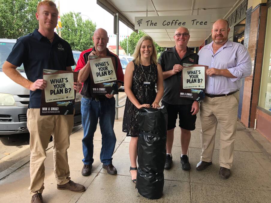 UNITED: Leeton Shire road safety officer Stephanie Puntoriero (centre) with representatives from the venues participating in the swag giveaway (from left) Jade Hart (Wade Hotel), Graeme Ahern (L&D), Paul Frazer (Hotel Leeton) and Andrew Hurst (YASC).