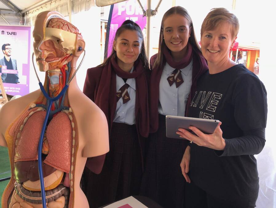 TELL ME MORE: Marian Catholic College students Maree Cirillo and Isobelle Smith with Melinda Gager from TAFE at last year's Western Riverina Careers Expo.