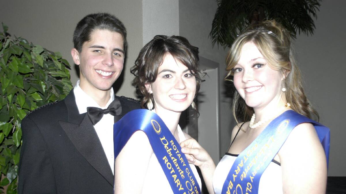 2008: Debutante of the Year Amanda O’Connell (middle), with her partner Justin Snaidero, is congratulated by last year’s winner Gaby Poloniato 