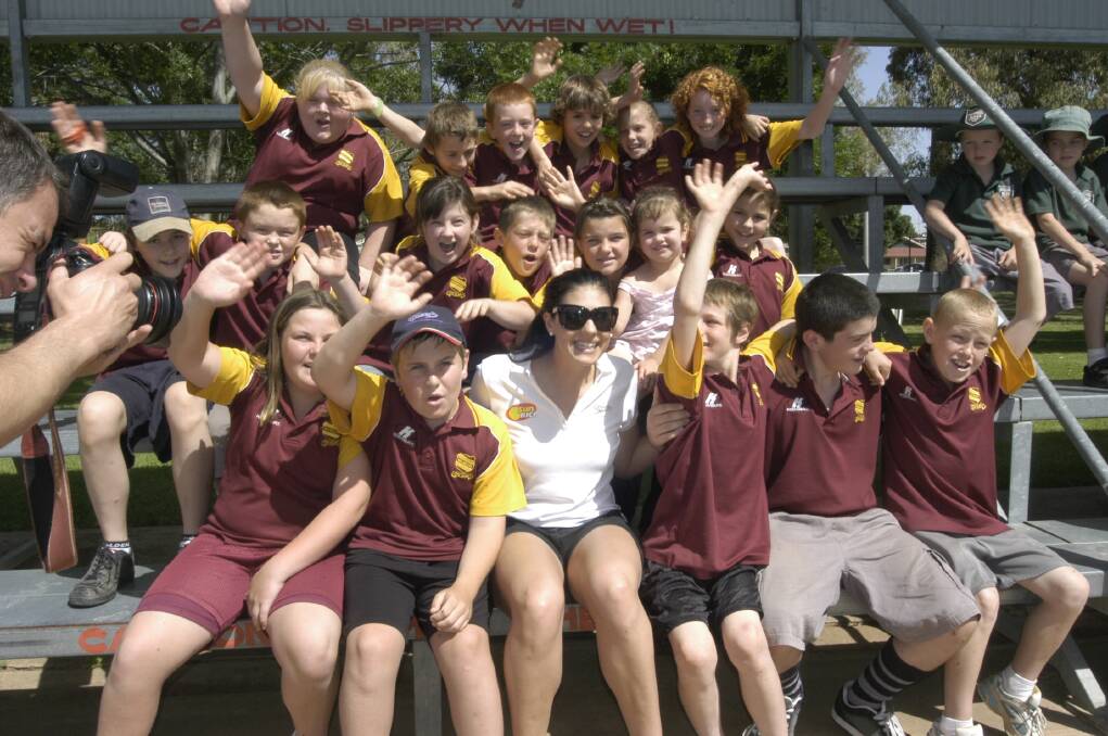 2008: SunRice brand ambassador, Olympic gold medallist Stephanie Rice, with Wamoon Public School students at a student Q&A session at the Leeton pool. Picture: John Gray