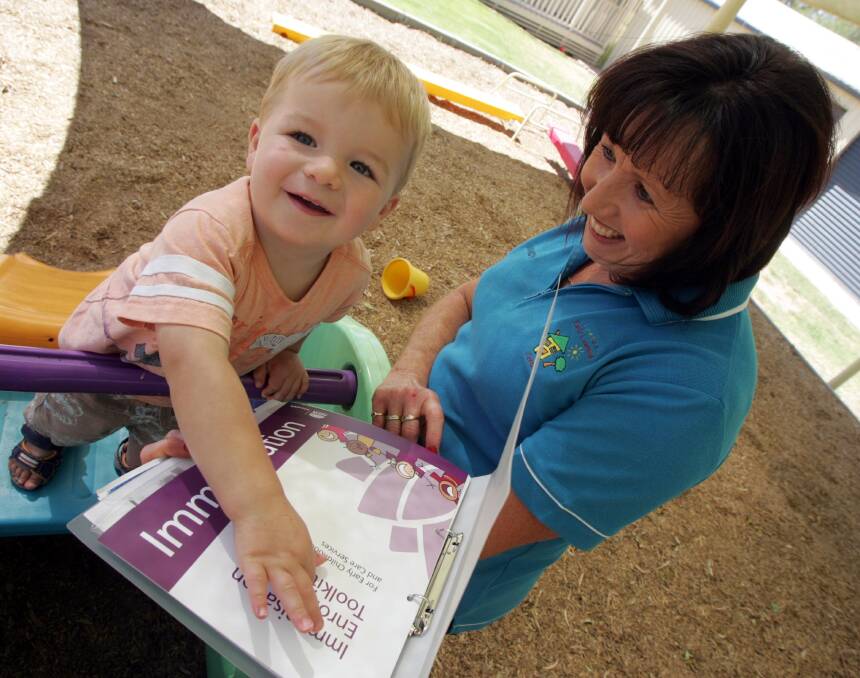 2014: Noah Stout, 22 months, ahows an interest in learning more about the vaccination legislation from Leeton Early Learning Centre director Mandy Day.