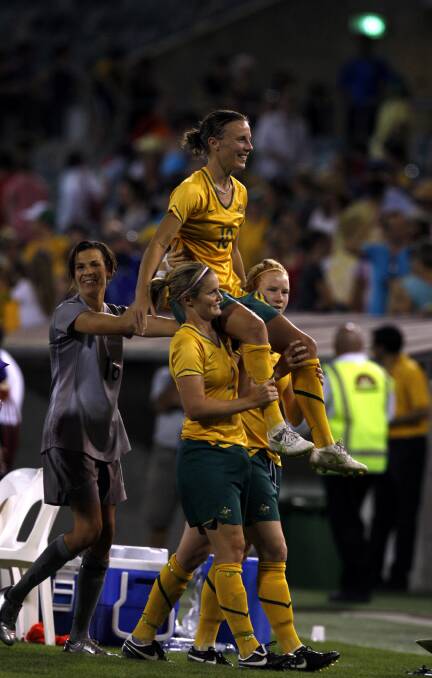 2009: Joanne Peters is chaired off the ground by her teammates in her last game as a Matilda on February 7 in Canberra against Italy. Picture: Fairfax Media