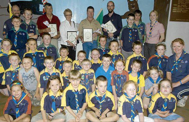 2008: Leeton 1st Scouts present certificates of appreciation and a white centenary scarf to community organisations and companies that have helped them (back, from left) Leeton Soldiers Club president Les Bonham, Rotary Club of Leeton representative Ruth Wade, owner of Guilford Transport Craig Guilford and The Irrigator editor John Gray.