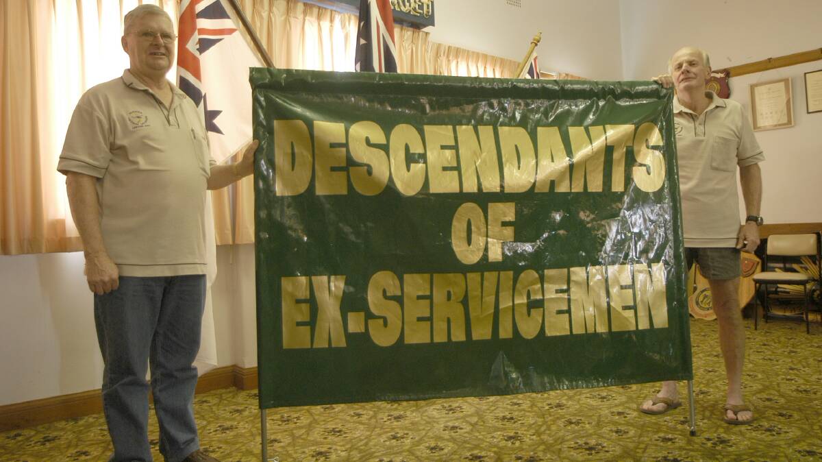2009: Leeton RSL Sub-Branch president John Power (left) and Member of the Leeton Vietnam Veterans Don Reilly display the new banner to be used in this years Anzac Day ceremonies.