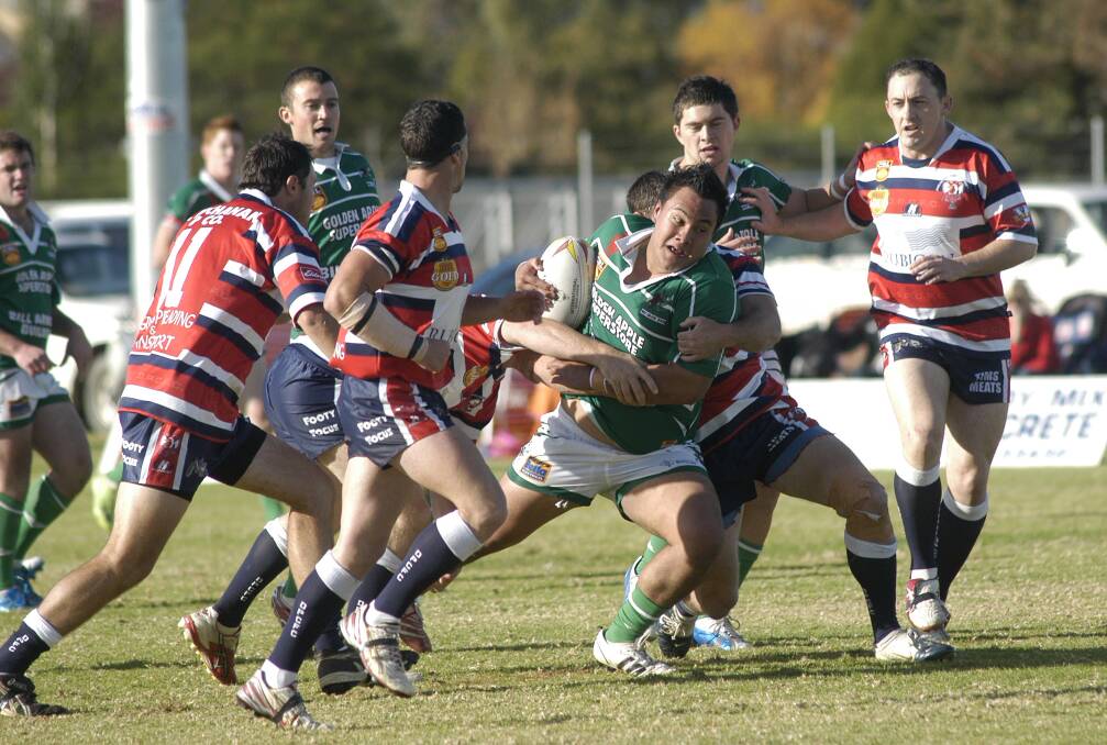 2009: Greens forward Tyson Foesther tries to break through Darlington Point-Coleamballys defence in Leetons win at No. 1 Oval on Sunday.