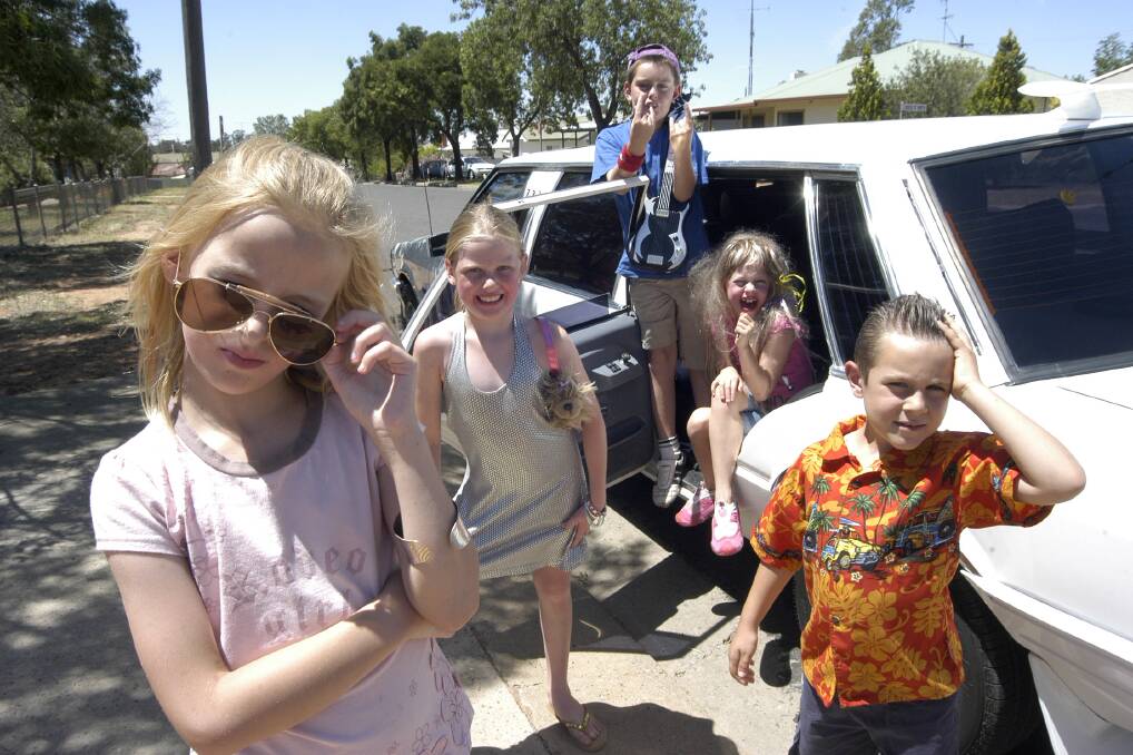2009: Grace Cooper, 8, dressed up as Hannah Montana, Chelsea Connell, 8,
as Paris Hilton, Thomas Bullivant, 9, as a lead guitarist, Angie Tatt, 7, was also Hannah Montana and Riley Taskiran, 7, took on Elvis, circa Blue Hawaii, at the Leeton Out of School Care rock star day.