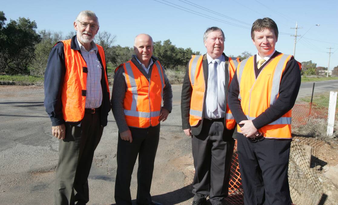 2013: Petersham Road last week following the announcement of subsidy funding to Leeton Shire Council from the state government was (from left) mayor Paul Maytom, Member for Murrumbidgee Adrian Piccoli, council general manager John Batchelor and council director of engineering and technical 