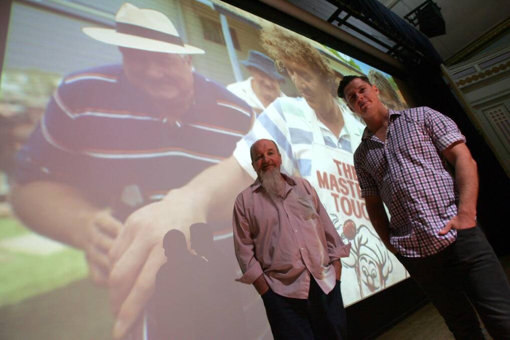 2013: Ready for the premiere at the Roxy Theatre are writerproducer Peter Cox (left) and writer-director Mark Grentell, standing in front of a still from the movie.
