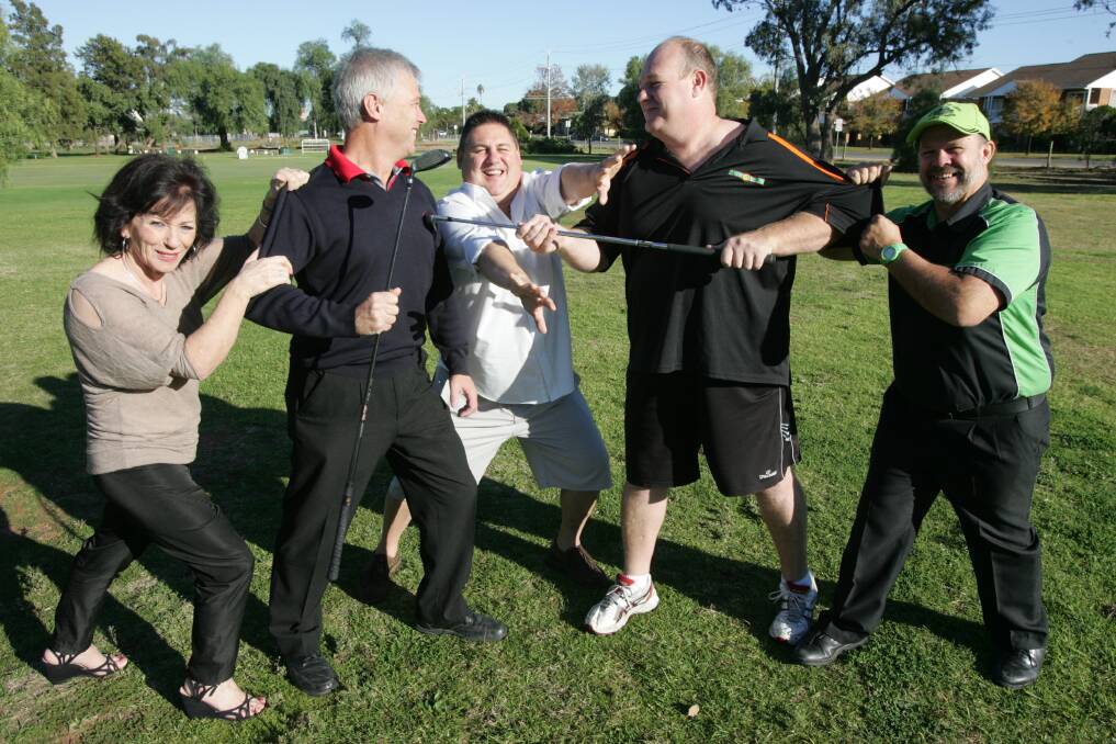 THE Friends of Luro and St Vincent De Paul charity golf day will be held next month, with regular golf day combatants Greg Gale (left) and Andrew Hurst (right) being
separated by sponsor Dan Findlay and held back by St Vincent de Paul Leeton conference vice-president Margaret Hogan (left) and Friends of Luro member George
Weston.