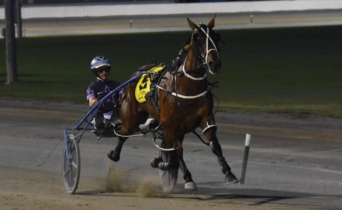 Blake Jones drives Glenledi Elvis to victory in the Leeton Pacers Cup on Monday night, leading a trifecta for wife Ellen's stable in the feature race. Picture by Courtney Rees