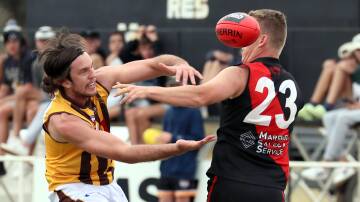 LONG LIVE THE FARRER LEAGUE: East Wagga-Kooringal's Wilson Thomas and Marrar's Liam James doing battle in the opening round of this year's Farrer League. AFL Riverina have confirmed it won't be the last year in the league's proud history. Picture: Les Smith