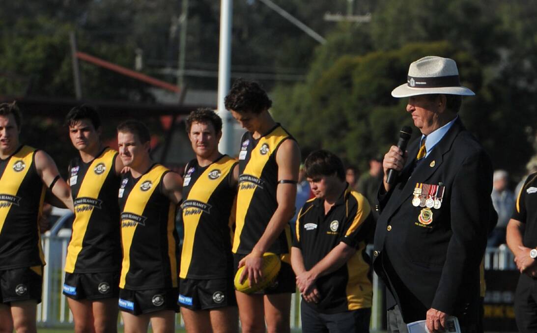 The Last Post at the 2014 Anzac Day commemorative games at Robertson Oval. 
