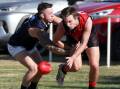 SUPPORT: Coleambally's Theo Valeri keeps the pressure on Marrar's Hugh Templeton at Langtry Oval last year. The Blues support Marrar's call for the Farrer League to be left untouched.