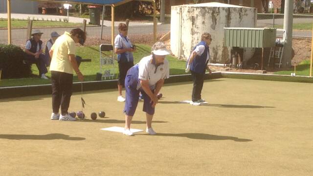 ON THE RINK: Joan Bourke & Shirley Tyack on the mat, with Marika Pete & Dian Colyer preparing to bowl. PHOTO: Supplied