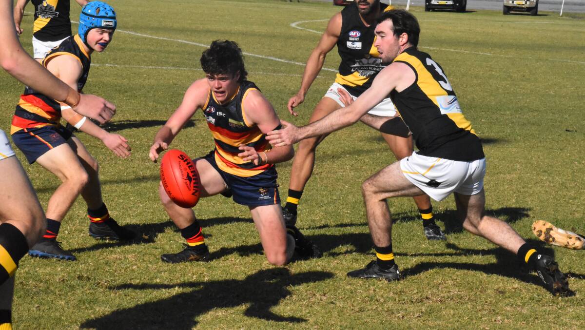 SURROUNDED: Crows' Nathan Ryan looks to bring the ball into his possession during his side's loss to Wagga Tigers. PHOTO: Liam Warren
