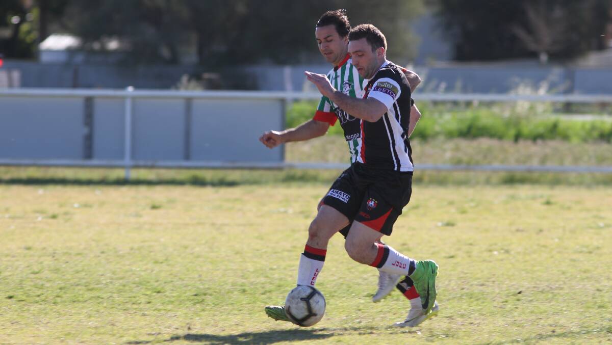 ON HOLD: Leeton United's Adam Raso looks to maintain possession during a game in the Football Wagga competition last season. PHOTO: Talia Pattison