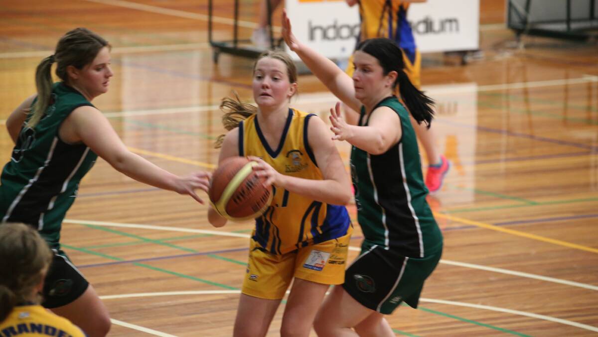 CLOSE DEFENCE: Leeton's Keira McCallum and Lauren Valenta try to close down Narrandera's Alexa Hitchens. Picture: Anthony Stipo