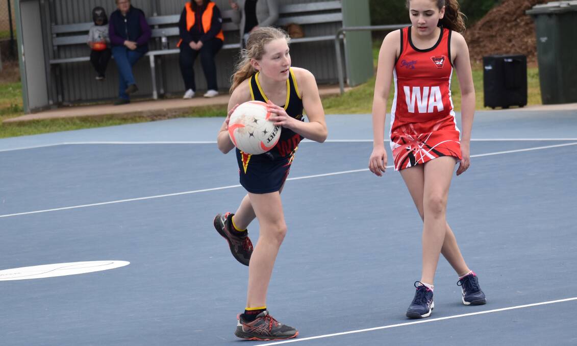 Crows under 13s Red's Charlotte Turner looks to make a pass during their clash with Griffith Red earlier in the season.