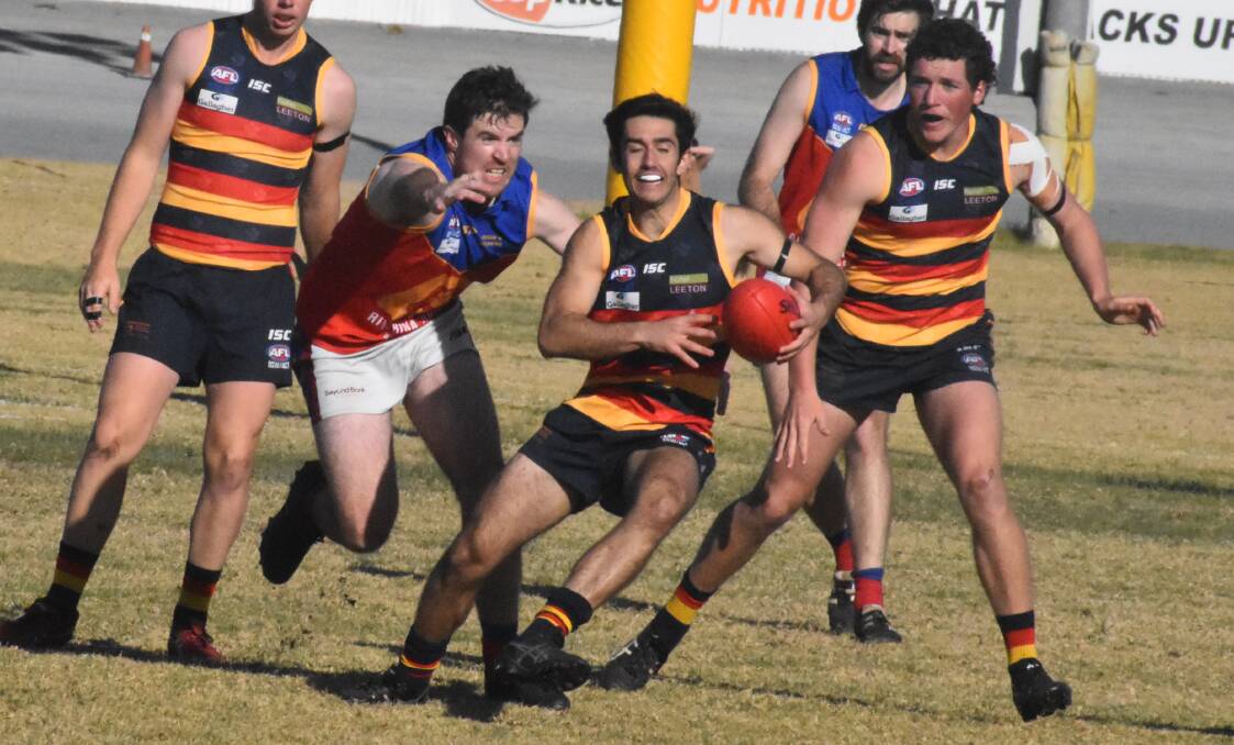 SCOOT: Crows debutant Chris Iannelli tries to evade the Lions defence during a tough game for the Leeton-Whitton side. PHOTO: Liam Warren
