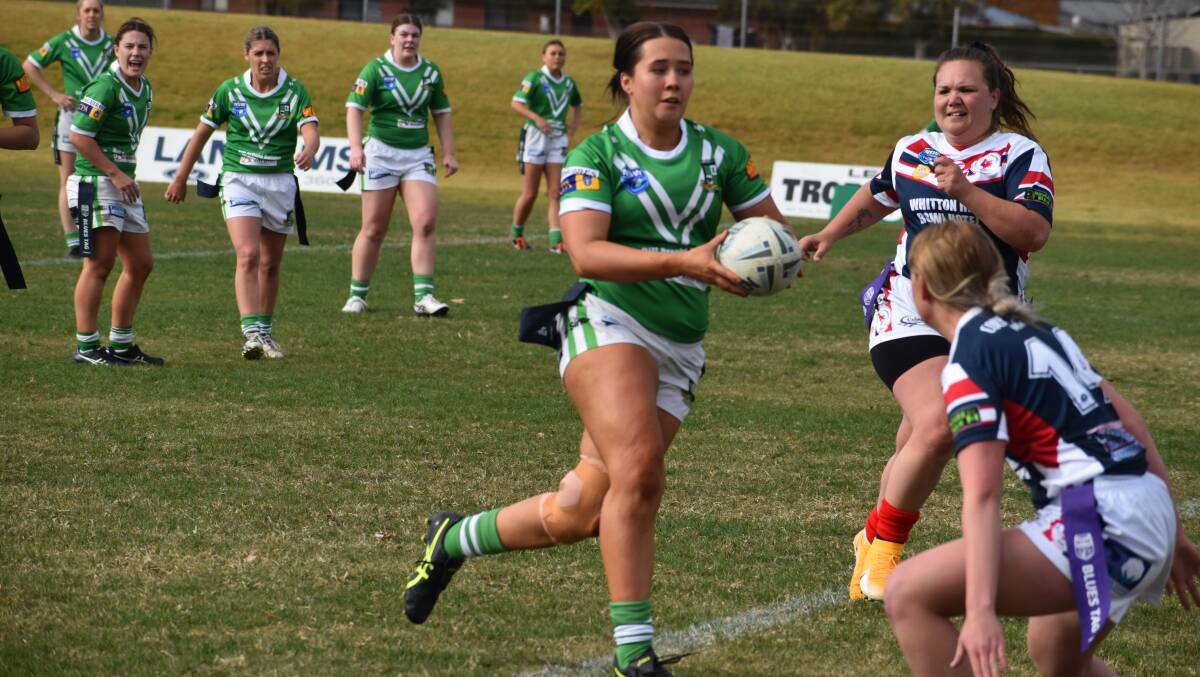 PULLING THE DEFENCE: Leeton's Sophie McGregor runs at the Darlington Point Coleambally defence on Sunday. PHOTO: Liam Warren