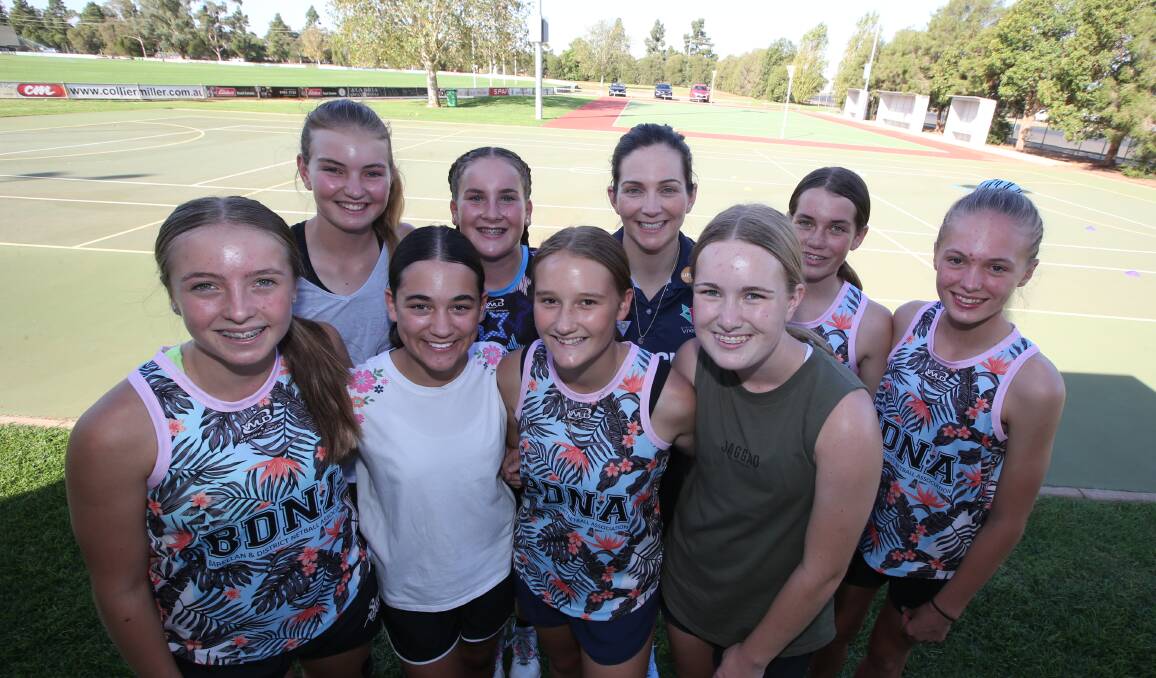 HARD AT WORK: The BDNA under 14s side prepare to be put through their paces by Johannah Curran (back,centre). PHOTO: Anthony Stipo
