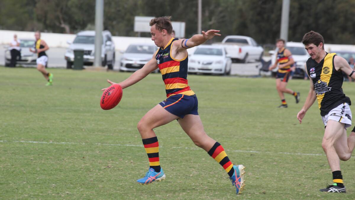 MOVING FORWARD: Crows' Coopa Steele looks to find a teammate with a long drop punt during the Crows clash with Wagga before the representative bye. PHOTO: Anthony Stipo