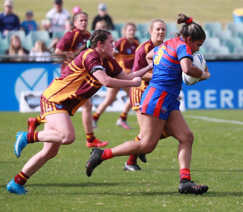 MOVING ON UP: Tess Staines looks to bring down her Newcastle opposition while playing for Riverina in the Women's Country Championship earlier this year. PHOTO: Les Smith