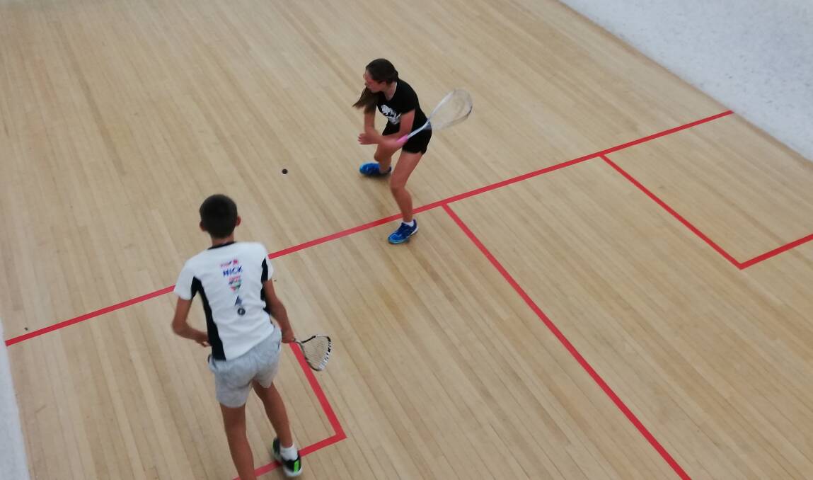 SIBLING RIVALS: Alayna Croucamp is about to play a backhand with her brother Nicholas ready to pounce during last week's squash. Picture: Contributed