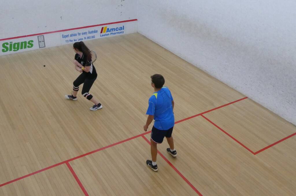 SQUASH: Brianna Gray-Mills is about to drive the ball with Brodie Lashbrook waiting to react during a recent game of squash. Picture: Contributed
