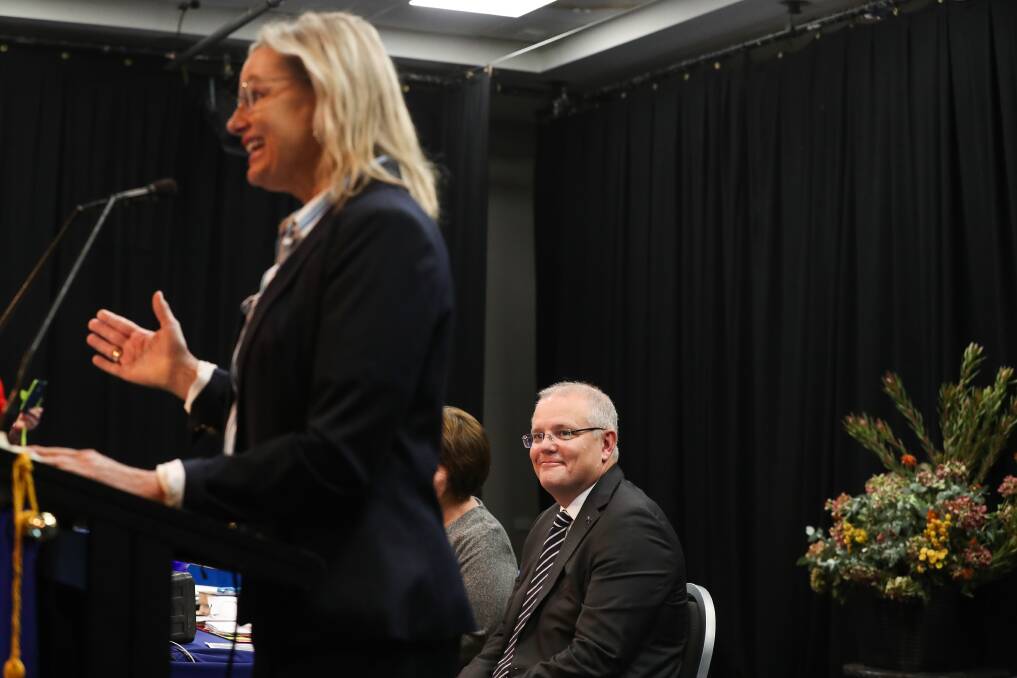 Behind you: Prime Minister Scott Morrison watches Sussan Ley speak in Albury in 2019. Questions loom about his role in a Farrer preselection vote. Picture: MARK JESSER