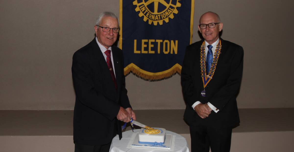LONG SERVICE: Bob Parsons, longest serving Rotarian in Leeton and president Tony Roddy celebrate the occasion. Picture: Ron Arel.