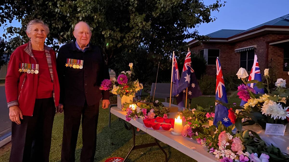 REFLECT: Kathleen and Bob Maskus made sure they marked Anzac Day from their front lawn on Saturday morning. Photo: Talia Pattison