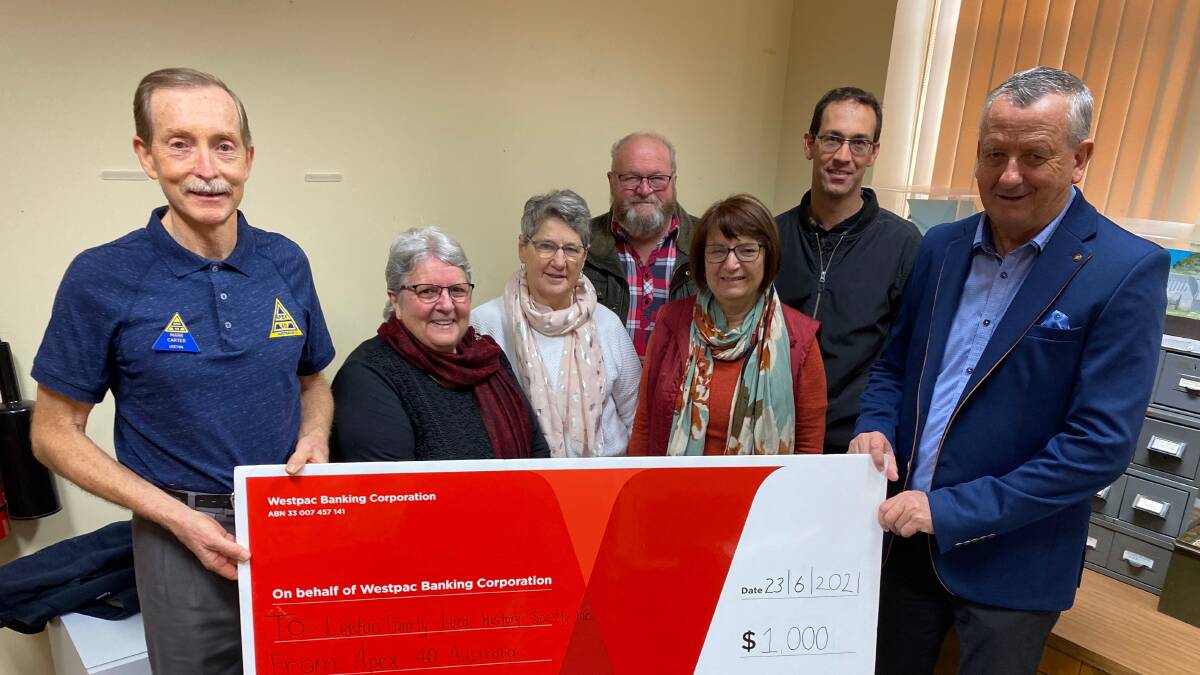 PLEASED: Apex 40 Leeton secretary Mark Carter (left) presents the funds to members of the Leeton Family and Local History Society. Photo: Talia Pattison 