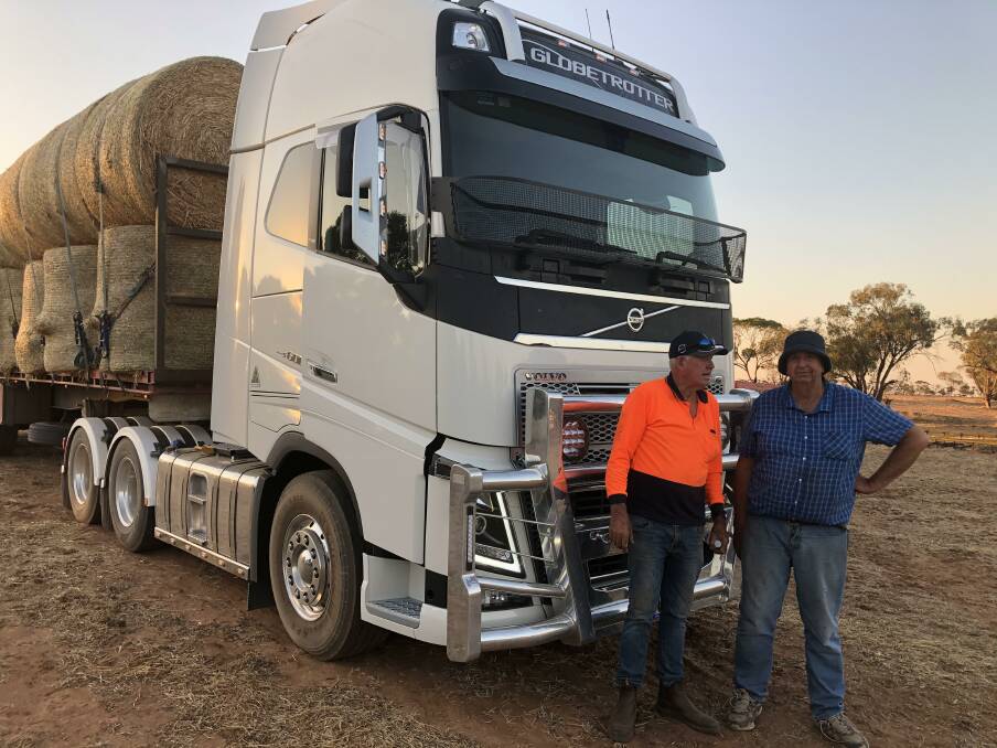 GENEROUS: Buster Ryan (left) with John Greggor who donated this load of hay for bushfire victims. 