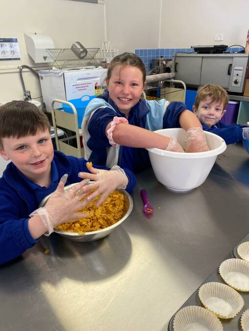HANDS ON: Yanco Public School students Tallis Tabain, Indie Dunn and Xander Eyles-McPhee gets busy in the kitchen. 
