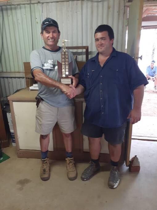 WELL DONE: Cris Salafia (left) presents the trophy to Adam Franco who was the high gun winner on the day. Photo: Contributed
