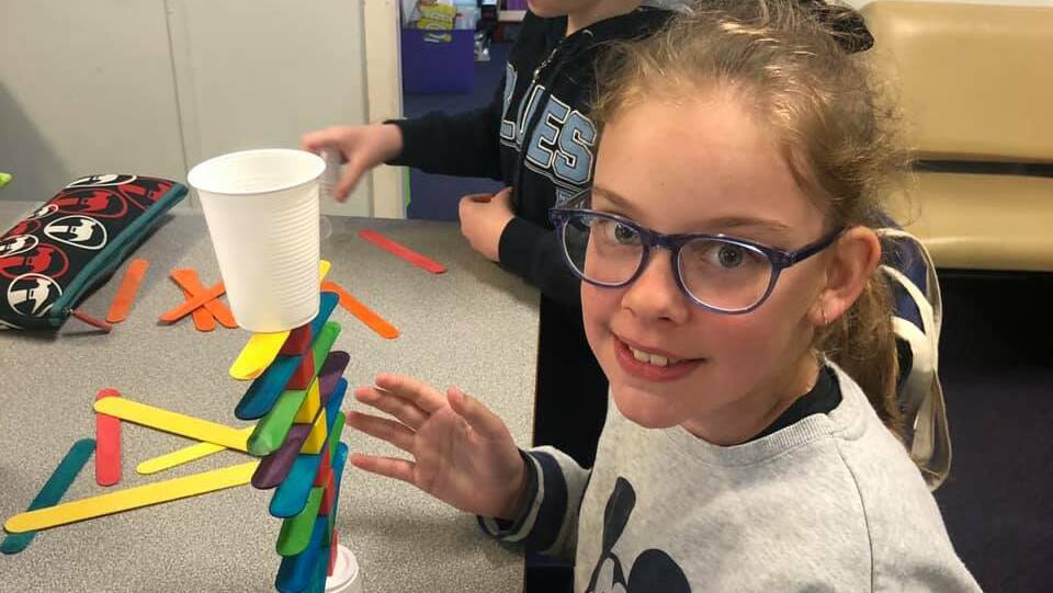 CREATE: Leeton Public School student Imogen Ryan enjoys one of the many activities held as part of the STEAM Day recently. 