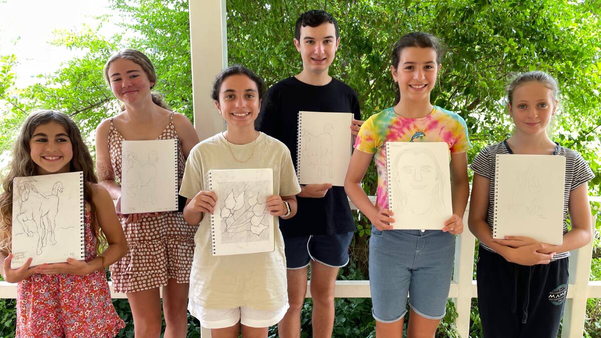 TALENT: The budding artists with some of their favourite pieces created at the workshops. Photo: Dorothy Roddy